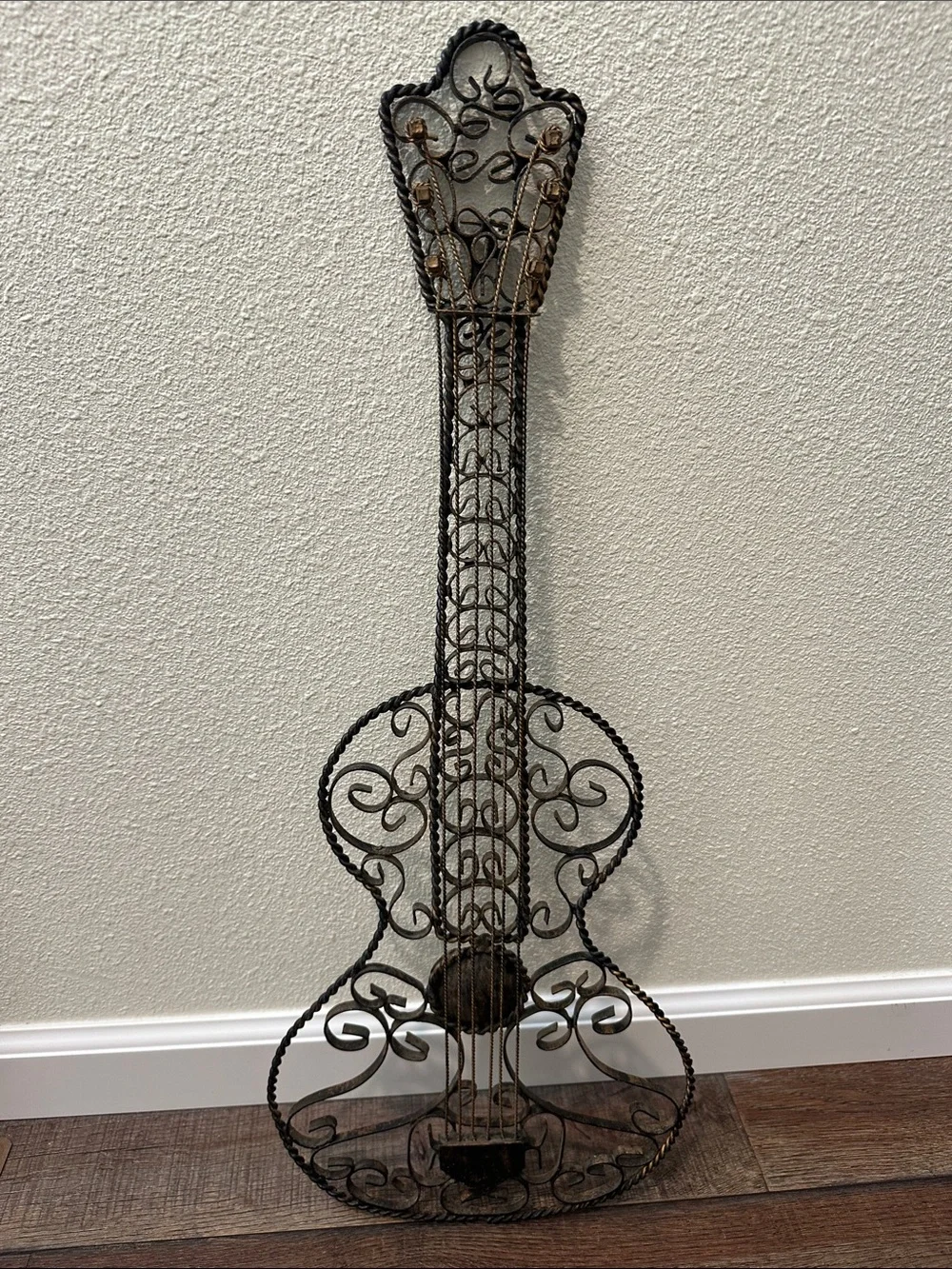 Ornate Metal Guitar Wall Sculpture in Black with distressed Bronze accents